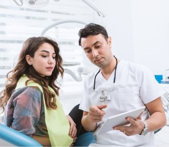 Dentist consulting to patient