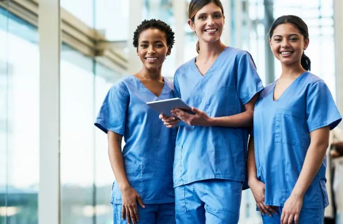 Dental employees posing in uniform